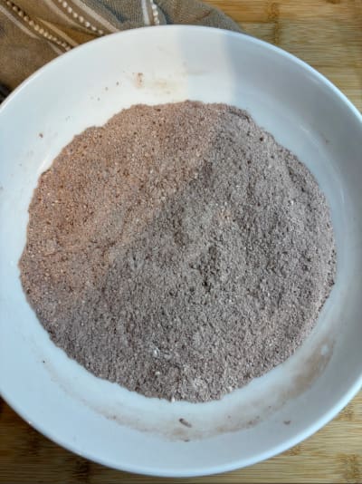 White bowl of cocoa baking mix