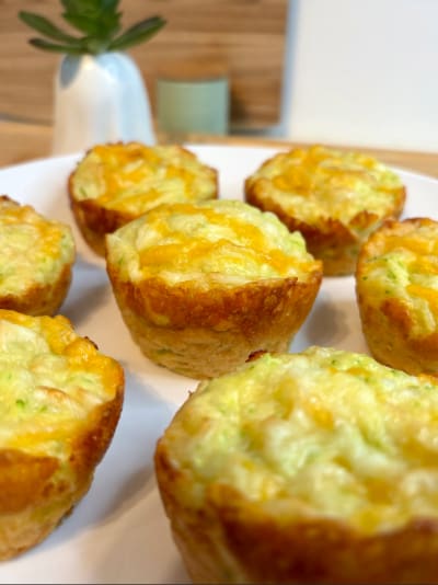 Cheesy mini egg muffins on plate