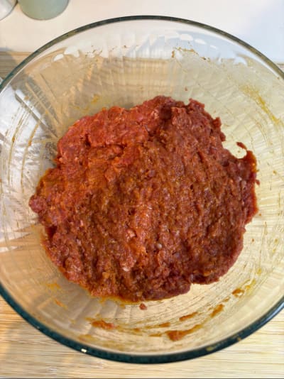 Glass bowl of red tomato sauce